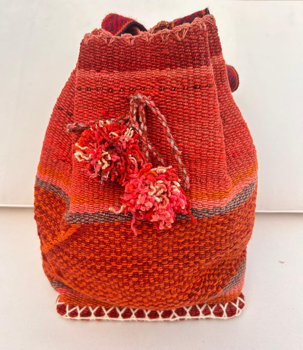 Woven backpack with a flower design