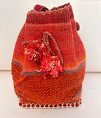 Woven backpack with a flower design